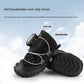 Black dog shoe shown from the heel to show the pull tab and reflective lace