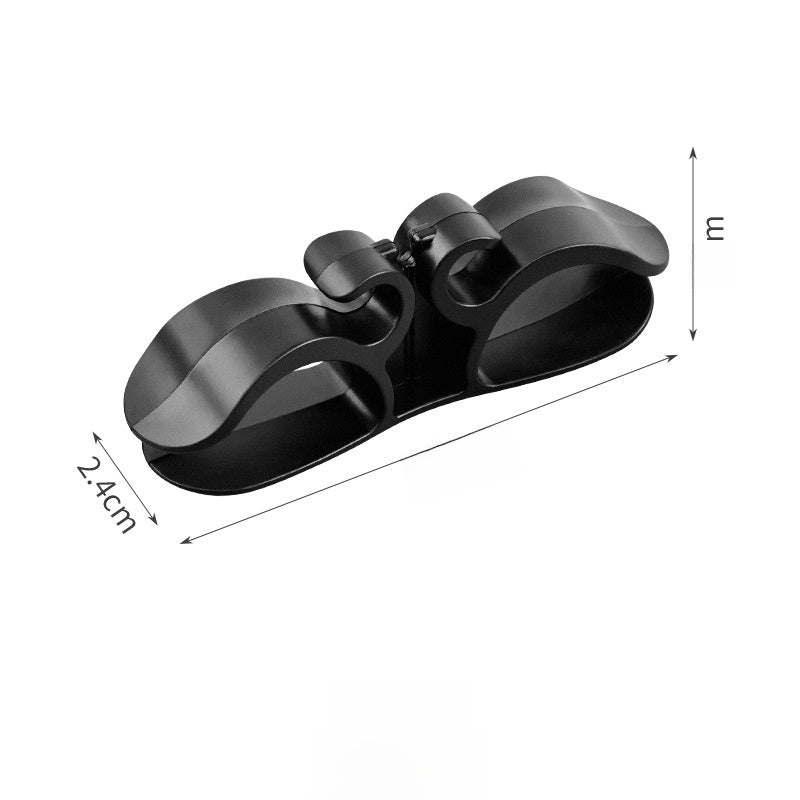 Self adhesive cord organizer with a plug holder slot for tidy cables
