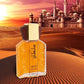 Sultan eau de toilette bottle on rippled desert sand with a domed palace and a low sun behind it