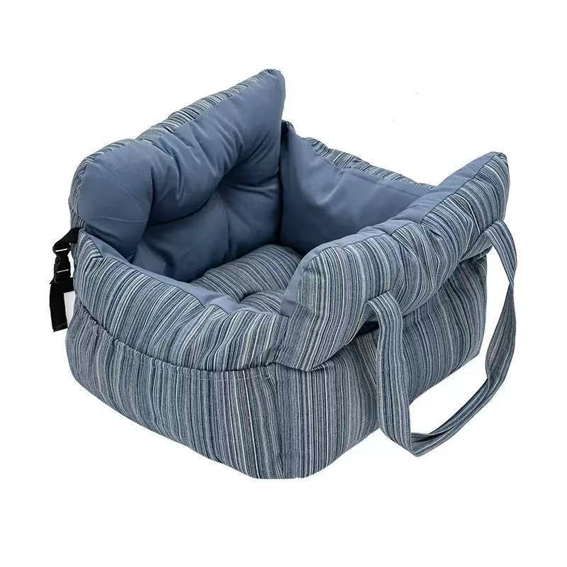 Padded car seat pet bed with raised bolster walls, carry handles and an inner clip in a brown corduroy colourway