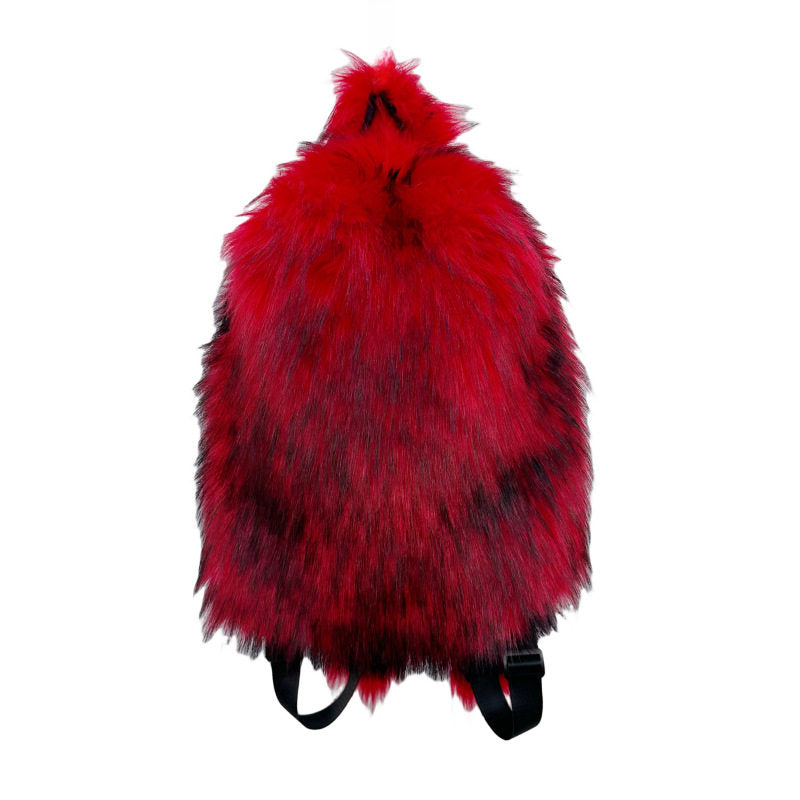 Plush fur travel backpack in soft studio lighting on plain ground