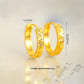 Gold-plated hoop earrings with measurements of 25.6 mm and 4.0 mm and an approximate weight of 8.5 g