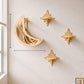 Wall mounted wooden cat perches with star shapes and a moon bed in daylight