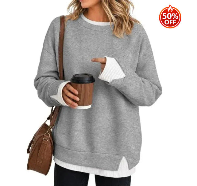 Gray women's sweatshirt showing the split hem and contrast white rib detail