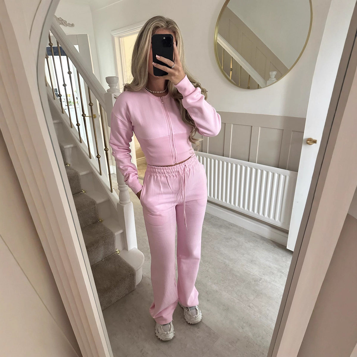 Womens two piece lounge set, a front zip jacket and straight leg drawstring pants in a soft sweat knit