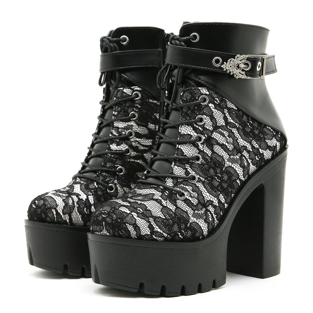 Womens platform ankle boot with round toe and a thick lug platform sole, studio shot