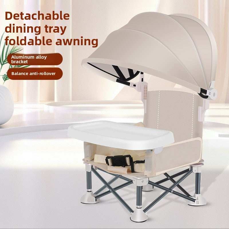 Folding baby feeding chair with the canopy folded back and the tray swung into place