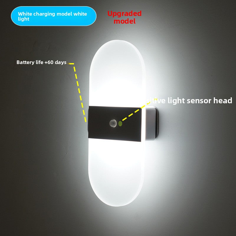 Frosted acrylic diffuser of the LED wall sconce in a soft warm glow closeup