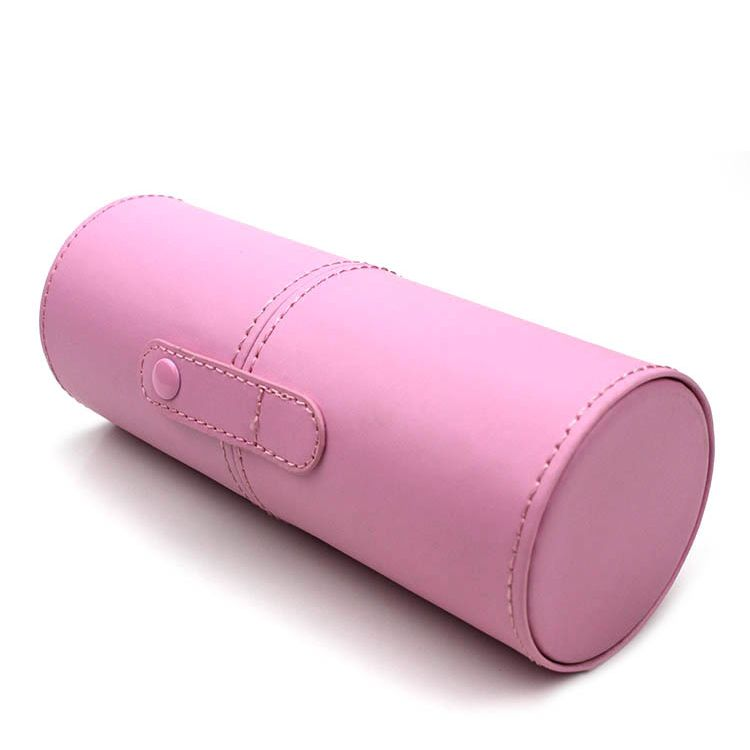 Solid pink PU makeup brush holder standing upright on white