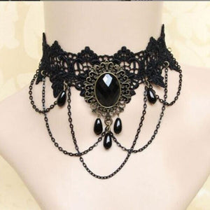 Black lace choker with a faceted cabochon in alloy filigree and teardrop bead swags on a bust