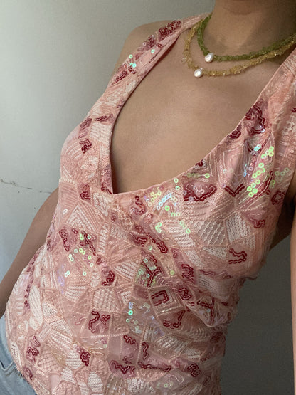 Scale reference of the sleeveless sequin V-neck top on a model