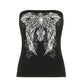 Black strapless tube top laid out flat, front view with a white and grey winged cross print and rose motifs