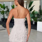 Strapless floral dress side profile showing the elasticated back panel and hem