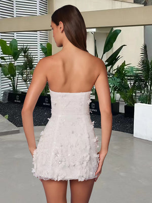 Strapless floral dress side profile showing the elasticated back panel and hem