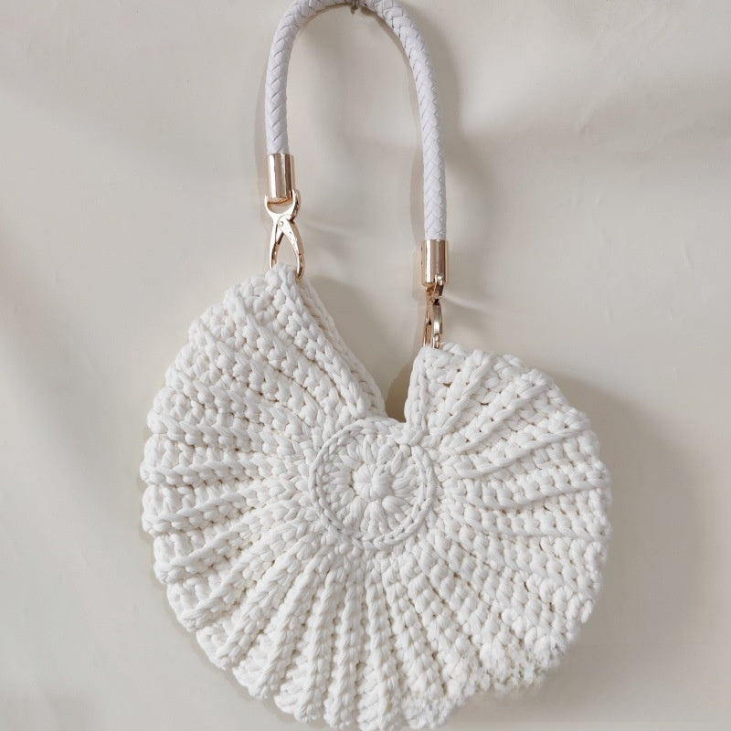 Handmade Woven Conch Shell Coin Purse | soft lighting studio shot