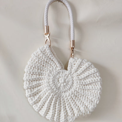 Handmade Woven Conch Shell Coin Purse | soft lighting studio shot