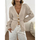 Apricot knit cardigan showing the cinched ribbed waist and long balloon sleeves