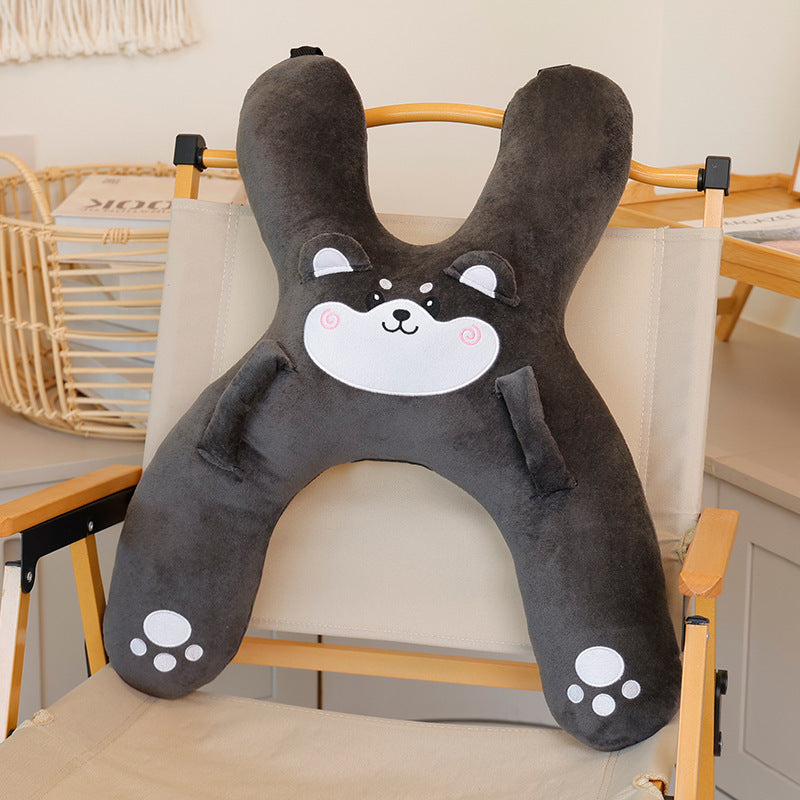 Grey husky plush car pillow draped over a child shoulder near the seat belt