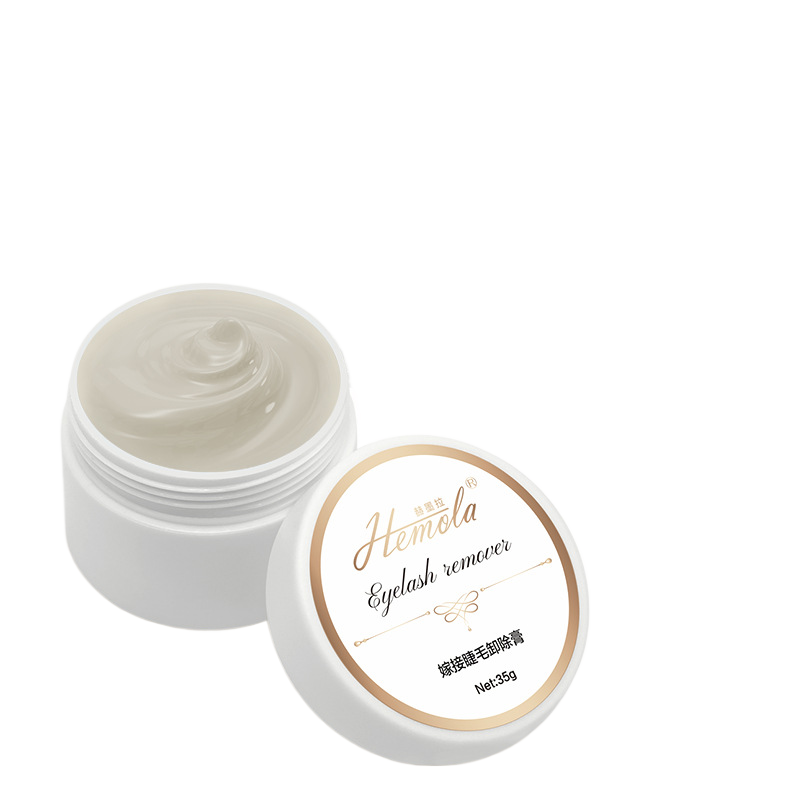 White jar of Hemola eyelash extension glue remover cream with a gold rimmed lid