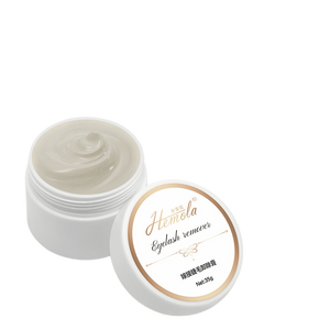 White jar of Hemola eyelash extension glue remover cream with a gold rimmed lid