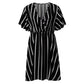 Pink and white striped surplice mini dress with flutter sleeves and gathered waist, worn