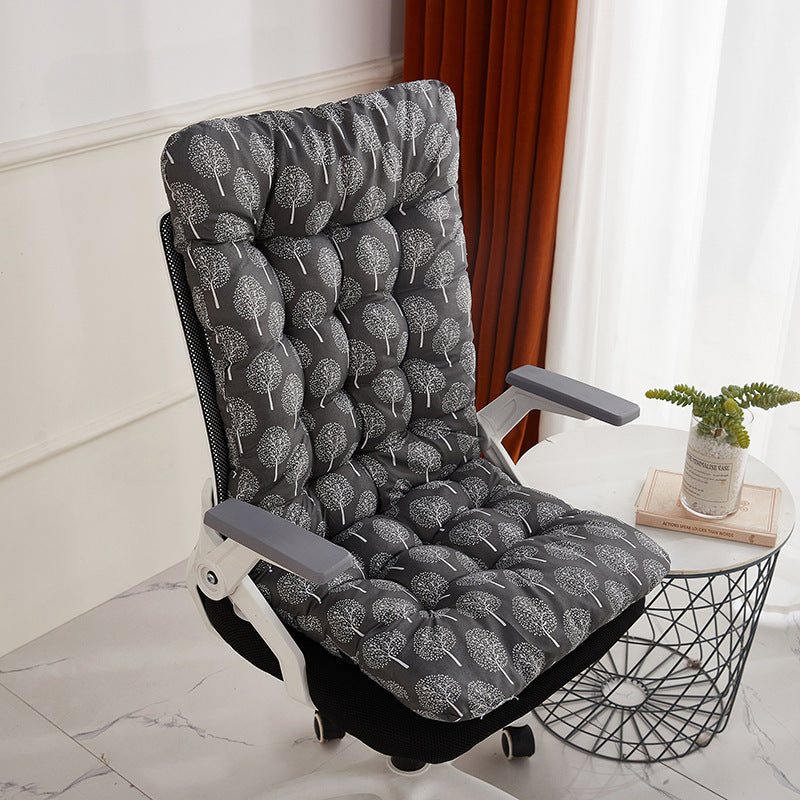 Gray tree print flannel cushion covering an office chair back and seat by a marble table