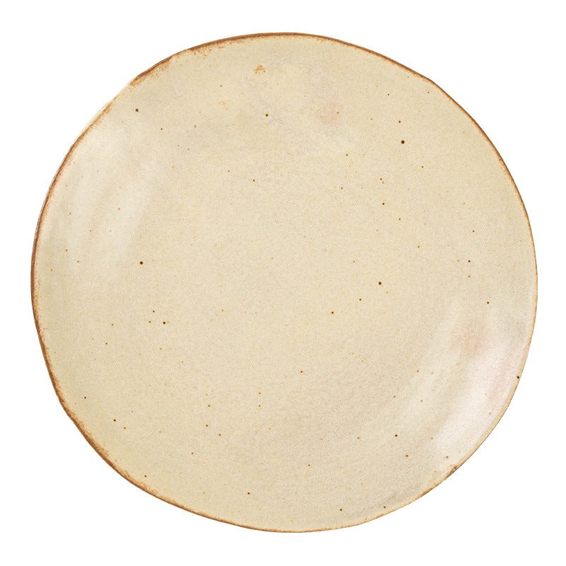Wabi-sabi ceramic plate styled with a fresh salad