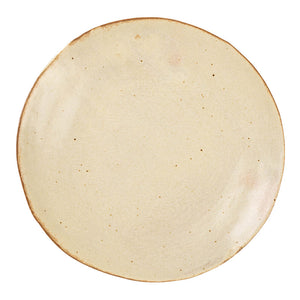 Wabi-sabi ceramic plate styled with a fresh salad