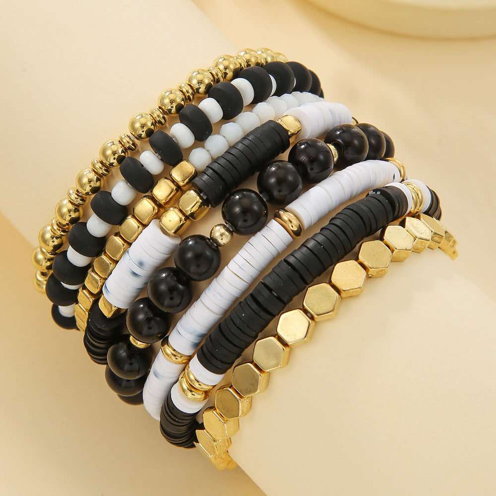 Beaded bracelet stack worn during a daily moment showing layered rows of beads