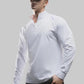 Men's long sleeve sport shirt shown from an angle during movement