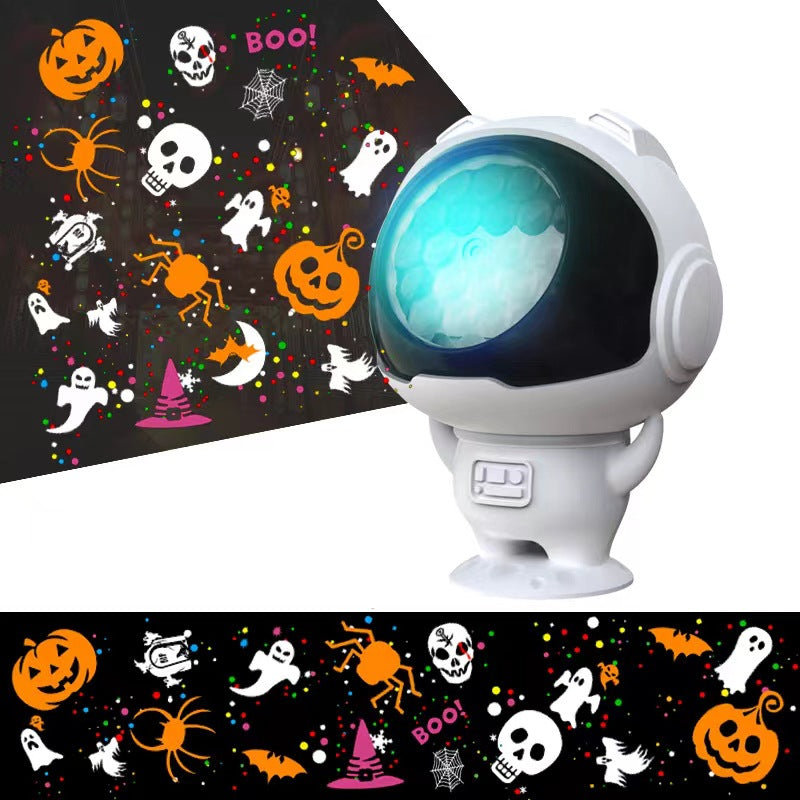 White astronaut-shaped LED projector casting teal and orange Halloween ghost patterns