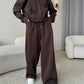 Brown zip front hooded sweatshirt and wide leg trousers set, Brown color, worn by a model, the Size M option