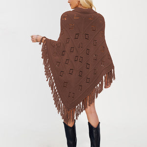 Womens knit fringe poncho falling open over the arms in a cape shape with pointed hem