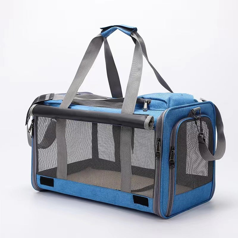 Soft-sided pet carrier detail of mesh ventilation panel and zip pulls