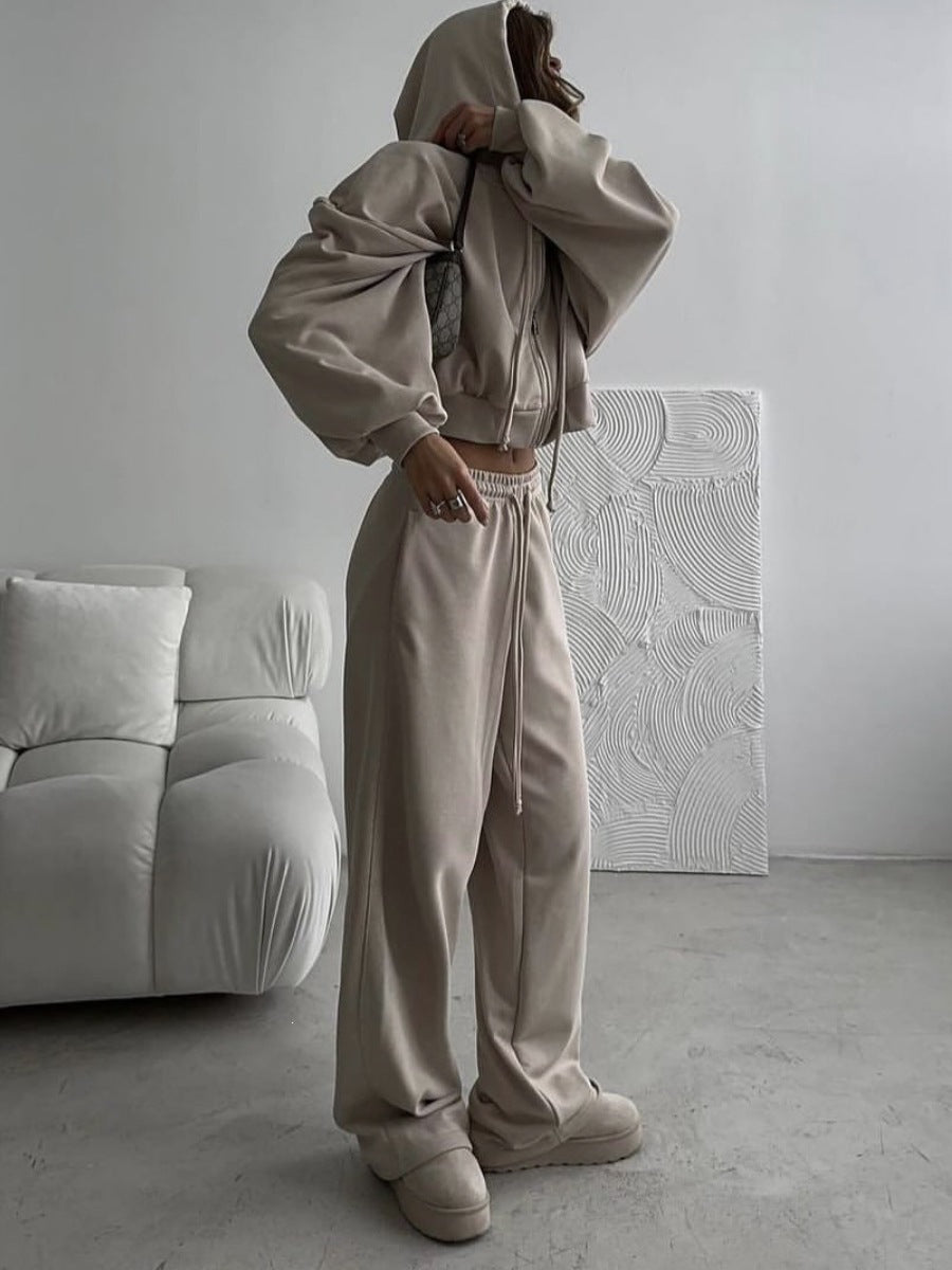 Khaki zip-up hoodie and wide leg trousers set worn by a woman, option photo for size S