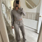 Womens two piece lounge set, a front zip jacket and straight leg drawstring pants in a soft sweat knit