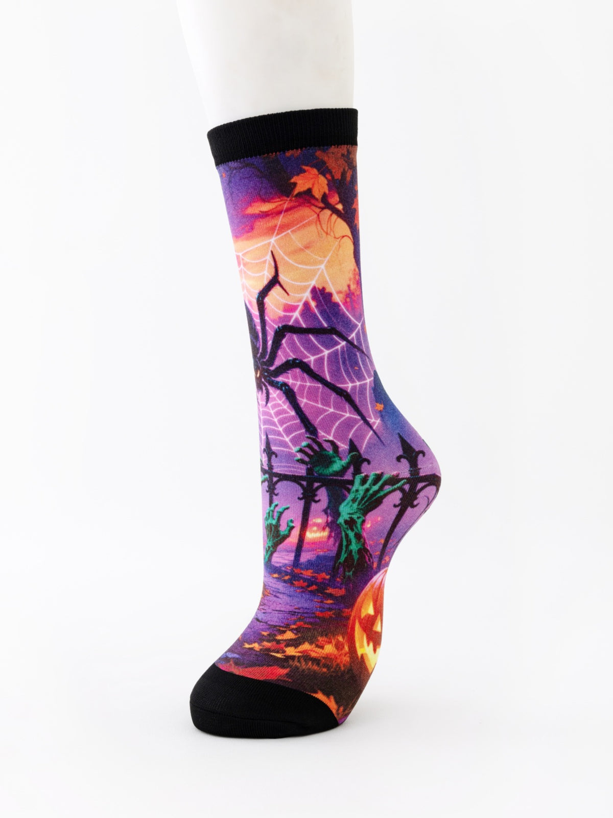 Mid-calf sock on a mannequin printed with a purple spider web and a pumpkin