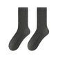 Pair of dark gray ribbed mid-calf socks on a white background