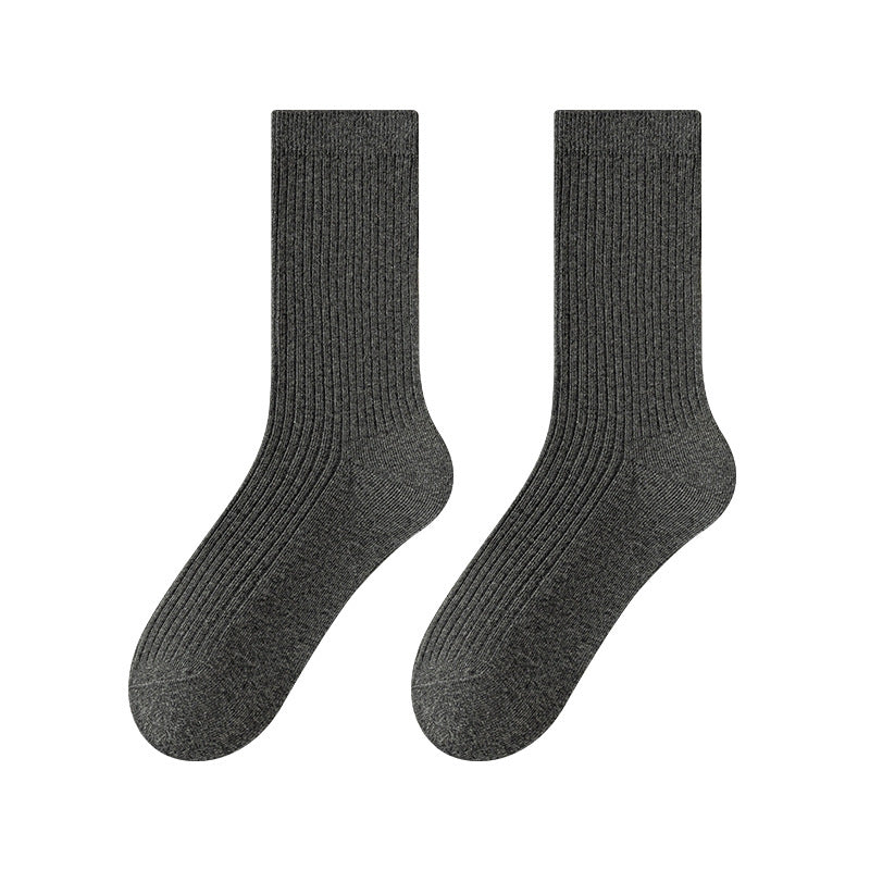 Pair of dark gray ribbed mid-calf socks on a white background