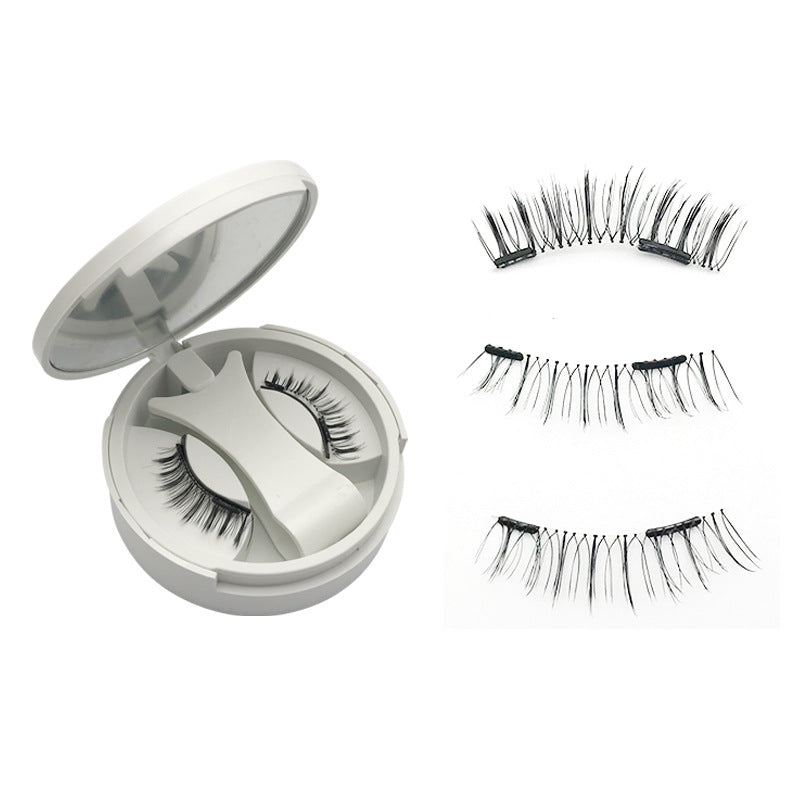 Round white lash compact with mirror shown closed on a plain background