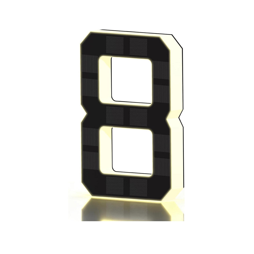 Black and gold solar LED house number sign, one character with a backlit warm outline, front view