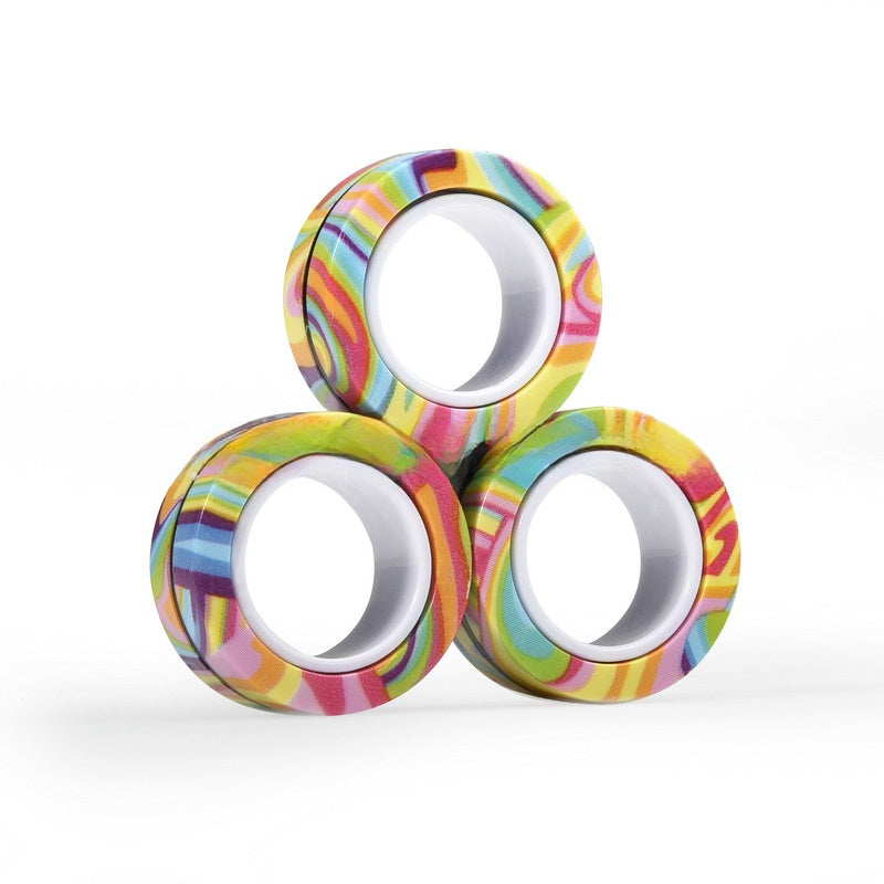 Magnetic fidget rings shown rolling and spinning in motion