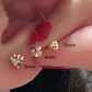 Mini heart gold stud earring worn on the lobe for an everyday delicate look
