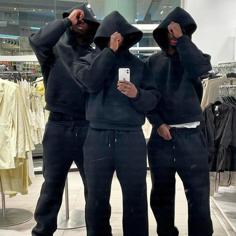Boxy cropped grey white hoodie with dropped shoulder and ribbed cuffs from the front