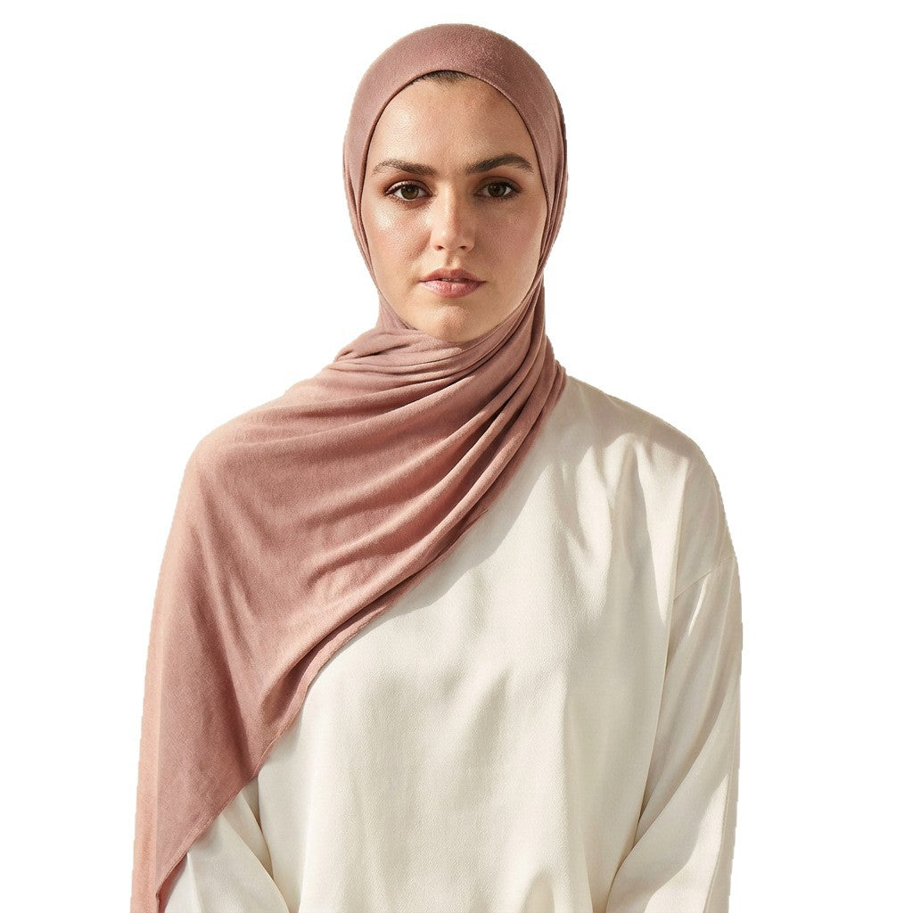 Close view of the plain knit modal cotton scarf showing its matte natural texture and soft drape