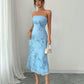 Front view of the sky blue embroidered strapless dress, fitted to the knee with a flared mesh hem