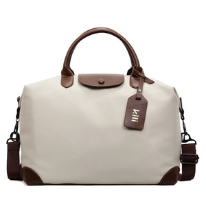 Off white nylon weekender bag, front view, brown rolled leather handles, flap and hanging name tag