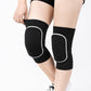 Black dance knee pads with white edge worn on bare legs, front view on model