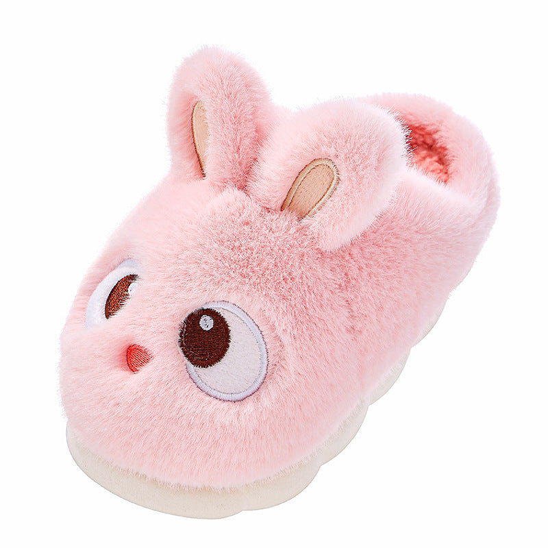 Pink cartoon bunny plush slipper with upright ears, big eyes and a white sole on a plain white background
