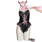 Black and pink one piece costume on a white background with a pink horn headband, a paddle and striped cuffs